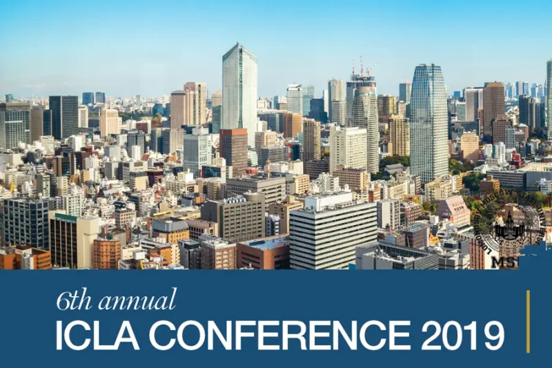 Event banner for the 6th Annual ICLA Conference 2019 featuring a daylight skyline of central Tokyo with high-rise buildings under a clear blue sky. The ICLA event title is displayed on a blue footer section.