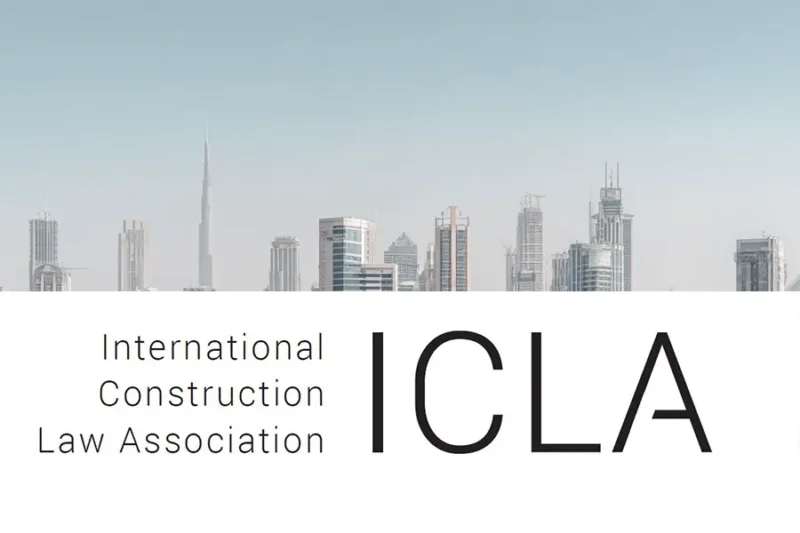 ICLA logo displayed above a light-toned city skyline featuring the Burj Khalifa and other modern skyscrapers, indicating an international scope with visual reference to Dubai.