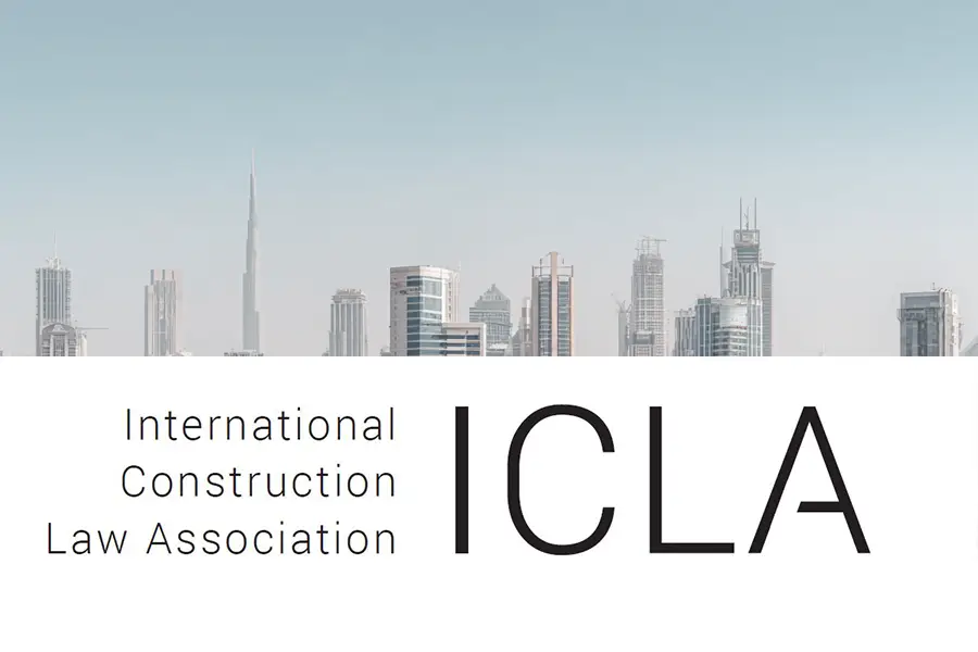 ICLA logo displayed above a light-toned city skyline featuring the Burj Khalifa and other modern skyscrapers, indicating an international scope with visual reference to Dubai.