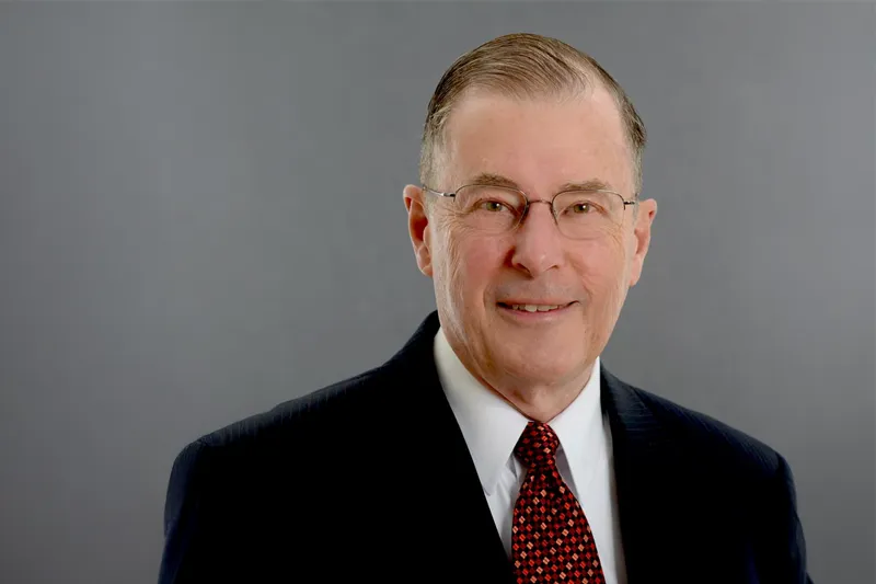 Studioportrait of Dr. Philip Bruner, with a neutral background