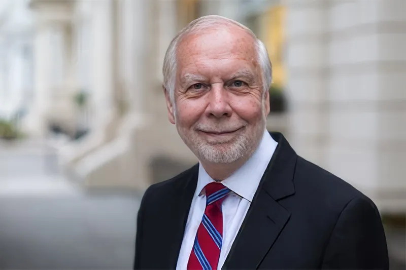 Portrait of John Bishop Outdoors with Urban Background
